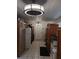 White kitchen cabinets, stainless steel appliances and wood countertops at 1401 W Spencer St, Plant City, FL 33563