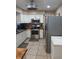 Kitchen with stainless steel appliances and white cabinets at 1401 W Spencer St, Plant City, FL 33563