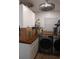 Laundry room with washer, dryer, and wood countertop at 1401 W Spencer St, Plant City, FL 33563
