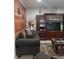 Cozy living room featuring wood wall accents and comfy seating at 1401 W Spencer St, Plant City, FL 33563