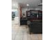Living room with view into kitchen and wood feature wall at 1401 W Spencer St, Plant City, FL 33563