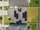 Aerial view of house roof featuring solar panels and fenced yard surrounded by neighboring homes at 12235 Creek Preserve Dr, Riverview, FL 33579