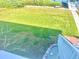 Landscaped backyard with waterfront access at 644 Bayshore Dr, Tarpon Springs, FL 34689