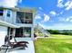 Two-story house with screened porch and deck at 644 Bayshore Dr, Tarpon Springs, FL 34689