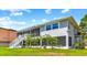 Two-story house with screened porch and stairs at 644 Bayshore Dr, Tarpon Springs, FL 34689