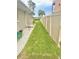 Landscaped side yard with privacy fence at 644 Bayshore Dr, Tarpon Springs, FL 34689