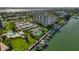 Aerial view of waterfront community with tennis courts and marina at 660 Island Way # 301, Clearwater Beach, FL 33767