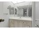 Bathroom boasts a vanity with mirror and a large sink at 660 Island Way # 301, Clearwater Beach, FL 33767