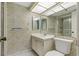 Clean bathroom with updated vanity and shower at 660 Island Way # 301, Clearwater Beach, FL 33767