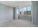 Bedroom with large window, light walls, and neutral carpet at 660 Island Way # 301, Clearwater Beach, FL 33767