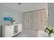 White entryway cabinet and closet with coastal-themed decor at 660 Island Way # 301, Clearwater Beach, FL 33767