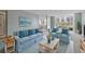 Bright living room with light blue sofa and coastal decor at 660 Island Way # 301, Clearwater Beach, FL 33767