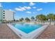 Community pool with brick patio, near beach at 11000 Gulf Blvd # 301, Treasure Island, FL 33706