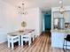 Modern dining room with contemporary light fixture and seating at 1768 Preston S St, St Petersburg, FL 33712