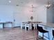 Bright dining room with a large table and modern light fixture at 1768 Preston S St, St Petersburg, FL 33712