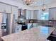 Modern kitchen with granite countertops, stainless steel appliances, and stylish gray cabinets at 1768 Preston S St, St Petersburg, FL 33712