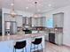 Modern kitchen with granite countertops, stainless steel appliances, and island at 1768 Preston S St, St Petersburg, FL 33712