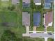 Aerial view of house and backyard, near pond at 879 De Soto Way, Tarpon Springs, FL 34689