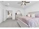 Main bedroom with king bed, dresser, and access to the hallway at 879 De Soto Way, Tarpon Springs, FL 34689