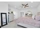 Spacious bedroom with a comfortable bed and plenty of light at 879 De Soto Way, Tarpon Springs, FL 34689