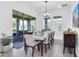 Bright dining room with sliding glass doors leading to a patio at 879 De Soto Way, Tarpon Springs, FL 34689