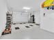 Garage with floor mats and storage shelving at 879 De Soto Way, Tarpon Springs, FL 34689