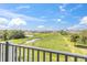 Enjoy serene views of a pond and lush green landscape at 879 De Soto Way, Tarpon Springs, FL 34689