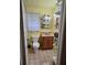 Clean bathroom with a toilet, vanity, and tiled floors at 13201 Vonn Rd, Largo, FL 33774