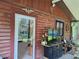 Home's exterior showcasing wood siding and a TV at 13201 Vonn Rd, Largo, FL 33774