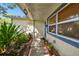 Charming walkway leading to the front door, adorned with lush landscaping and decorative features at 253 Sunlit Cove Ne Dr, St Petersburg, FL 33702