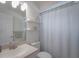 Simple bathroom featuring a toilet, sink, and shower at 4050 Eagle Cove East Dr, Palm Harbor, FL 34685