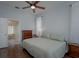 Spacious bedroom with ensuite bathroom and hardwood floors at 4050 Eagle Cove East Dr, Palm Harbor, FL 34685