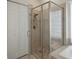 Large walk-in shower with glass enclosure and tiled walls at 4050 Eagle Cove East Dr, Palm Harbor, FL 34685