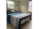 Bright bedroom with a double bed and window at 2627 24Th N Ave, St Petersburg, FL 33713