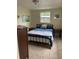 Bedroom with double bed, nightstands, and window at 2627 24Th N Ave, St Petersburg, FL 33713