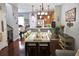 Bright dining room with hardwood floors and modern table at 6546 Marlberry Way, Largo, FL 33773