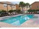 Community pool with lounge chairs and brick pavers at 6546 Marlberry Way, Largo, FL 33773