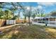 Large, fenced backyard with a storage shed and screened pool at 1549 Linwood Dr, Clearwater, FL 33755