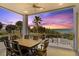Outdoor patio with ocean views and a dining table for six at 2 4Th Ave, Indian Rocks Beach, FL 33785