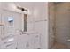 Modern bathroom with a walk-in shower and marble vanity at 2 4Th Ave, Indian Rocks Beach, FL 33785