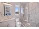 Modern bathroom with a walk-in shower and white vanity at 2 4Th Ave, Indian Rocks Beach, FL 33785