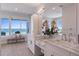 Double vanity bathroom with marble countertop and ocean view at 2 4Th Ave, Indian Rocks Beach, FL 33785