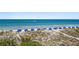 Expansive beach view with blue umbrellas at 2 4Th Ave, Indian Rocks Beach, FL 33785
