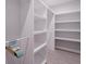 Large walk-in closet with ample shelving and hanging space at 2 4Th Ave, Indian Rocks Beach, FL 33785