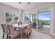 Bright dining room with ocean view and large sliding doors at 2 4Th Ave, Indian Rocks Beach, FL 33785