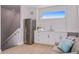 Small kitchenette with stainless steel appliances and white cabinets at 2 4Th Ave, Indian Rocks Beach, FL 33785