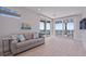 Living room with access to a private balcony and ocean view at 2 4Th Ave, Indian Rocks Beach, FL 33785