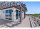 Rooftop deck with pergola and glass doors; ocean view at 2 4Th Ave, Indian Rocks Beach, FL 33785