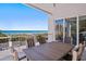Covered deck with ocean view and seating for six at 2 4Th Ave, Indian Rocks Beach, FL 33785