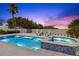 Inviting heated pool and spa with ocean views at sunset at 2 4Th Ave, Indian Rocks Beach, FL 33785